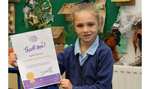 Pupil has 12 inch trim for charity