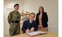 Head signs pledge to help military community Head signs pledge to help military community